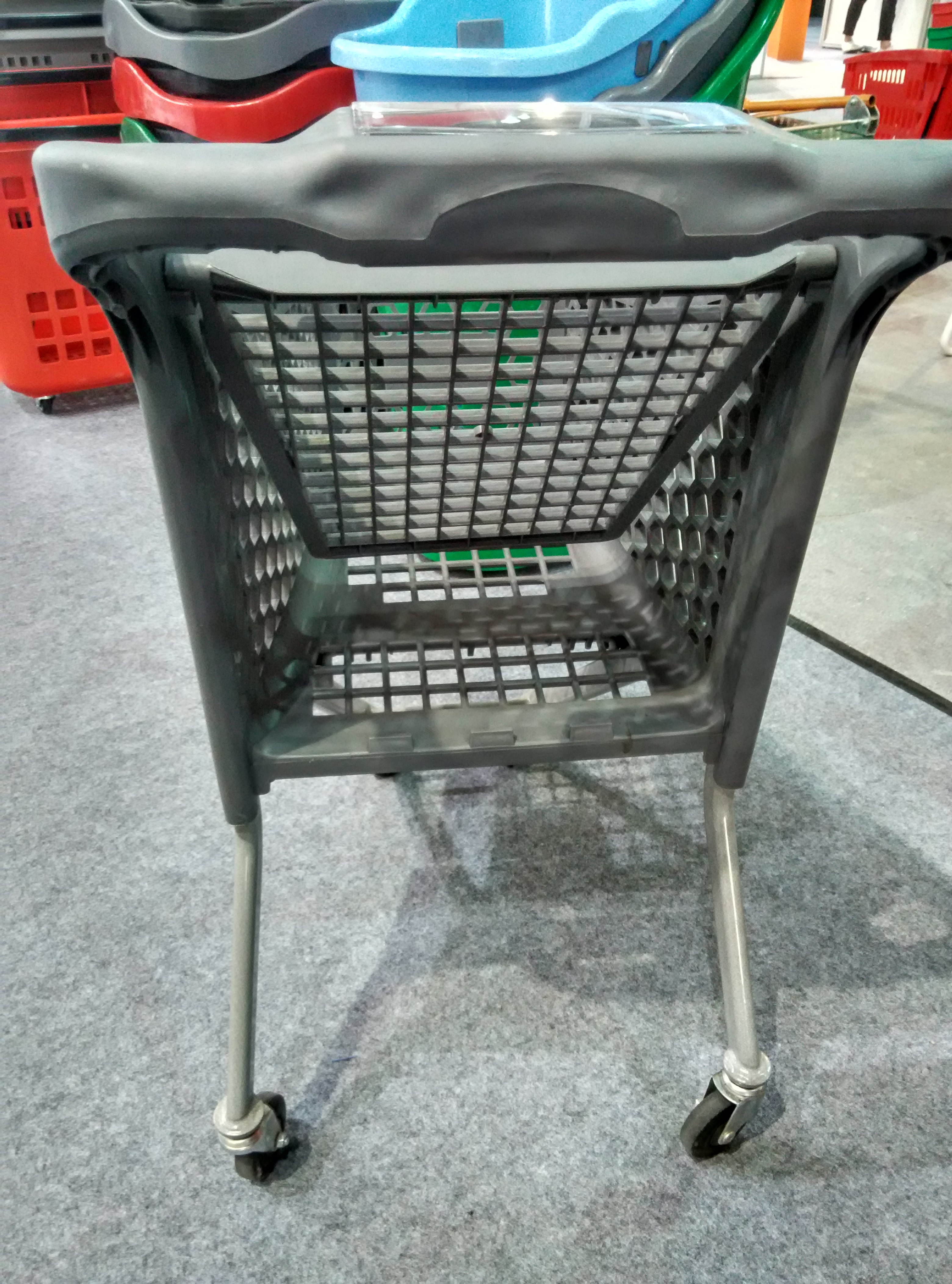 All-plastic grey children's mini stroller with a small flag details Picture