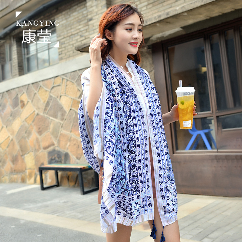 Fringe scarf flowing in the breeze on a sunny beach