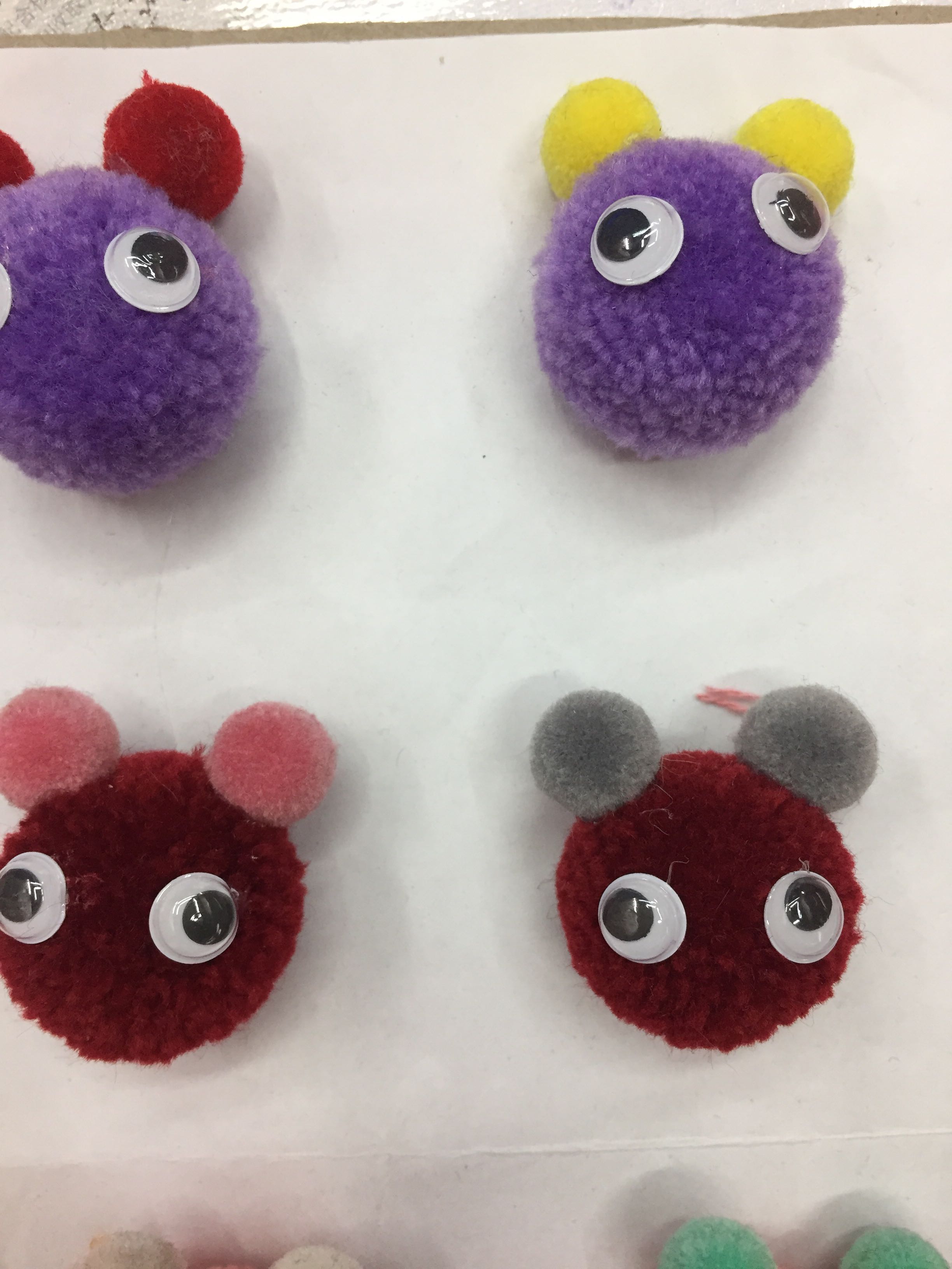 Red Panda Wool Ball on a Backpack