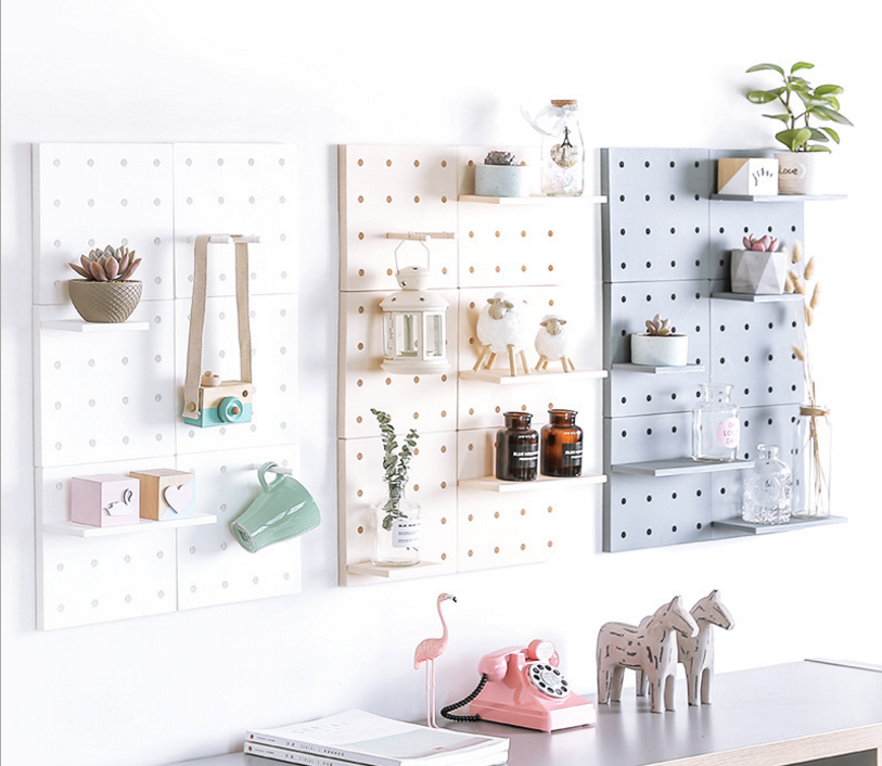 Plastic perforated boards are used for storing living room, kitchen, bedroom partitions, wall hangings, and wall shelves