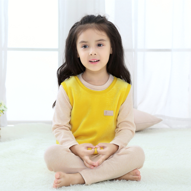 Child reading a book wearing the Cat Fairy Tale Fleece Vest