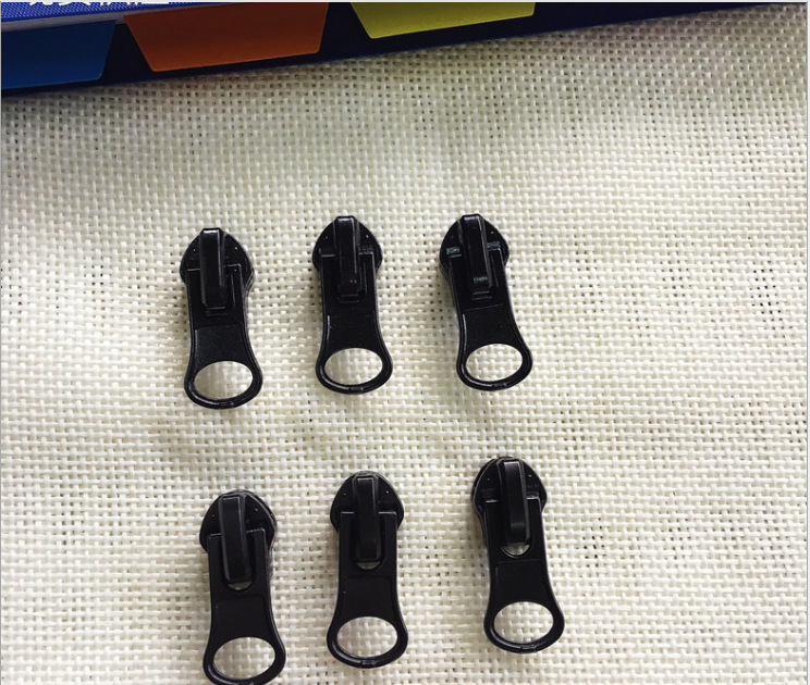 Promotion: No. 5 nylon reverse wearing almond pull TAB clothing waterproof zipper electrophoretic pull TAB hardware in stock pull TAB Application Scenario