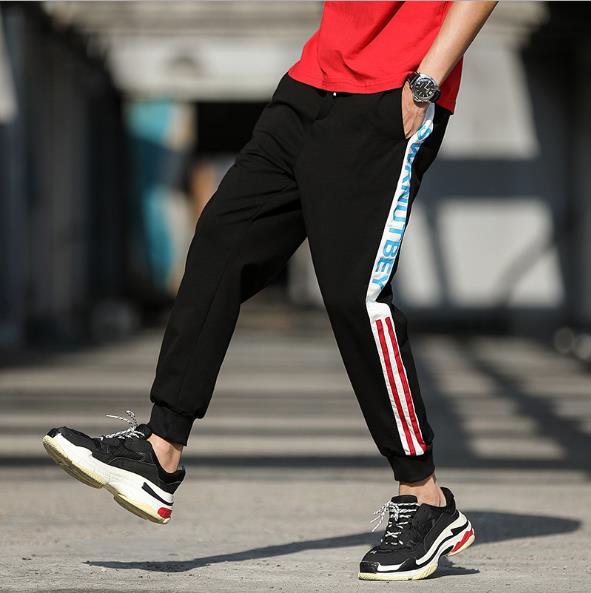 We are mainly promoting and stocking autumn casual pants, 9-inch pants, men's sporty SKR trendy small-leg striped pants