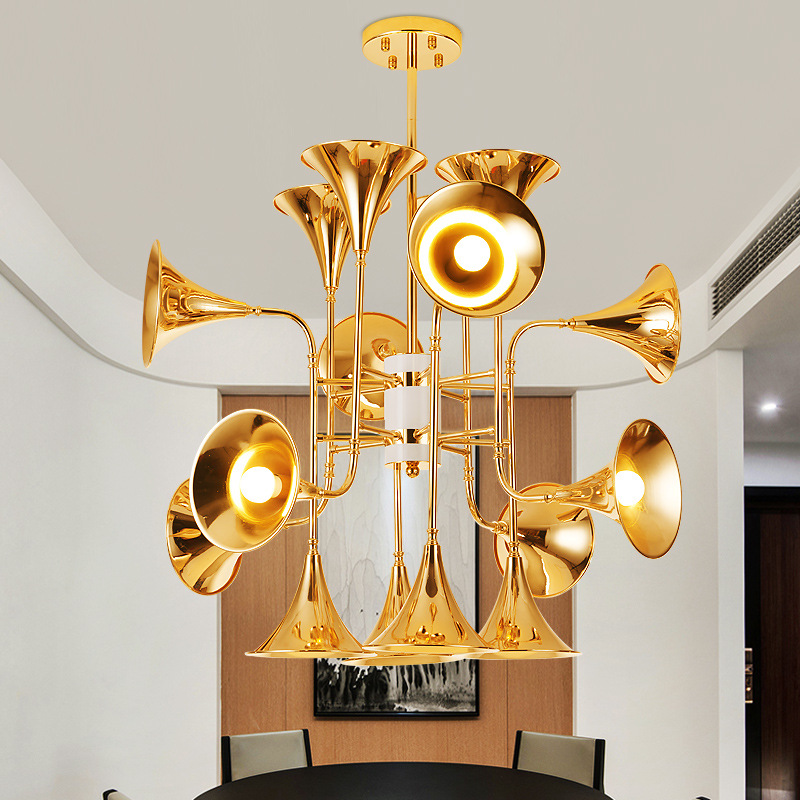Delightfull Horn Lamp A modern minimalist cafe with a gold engineered iron chandelier