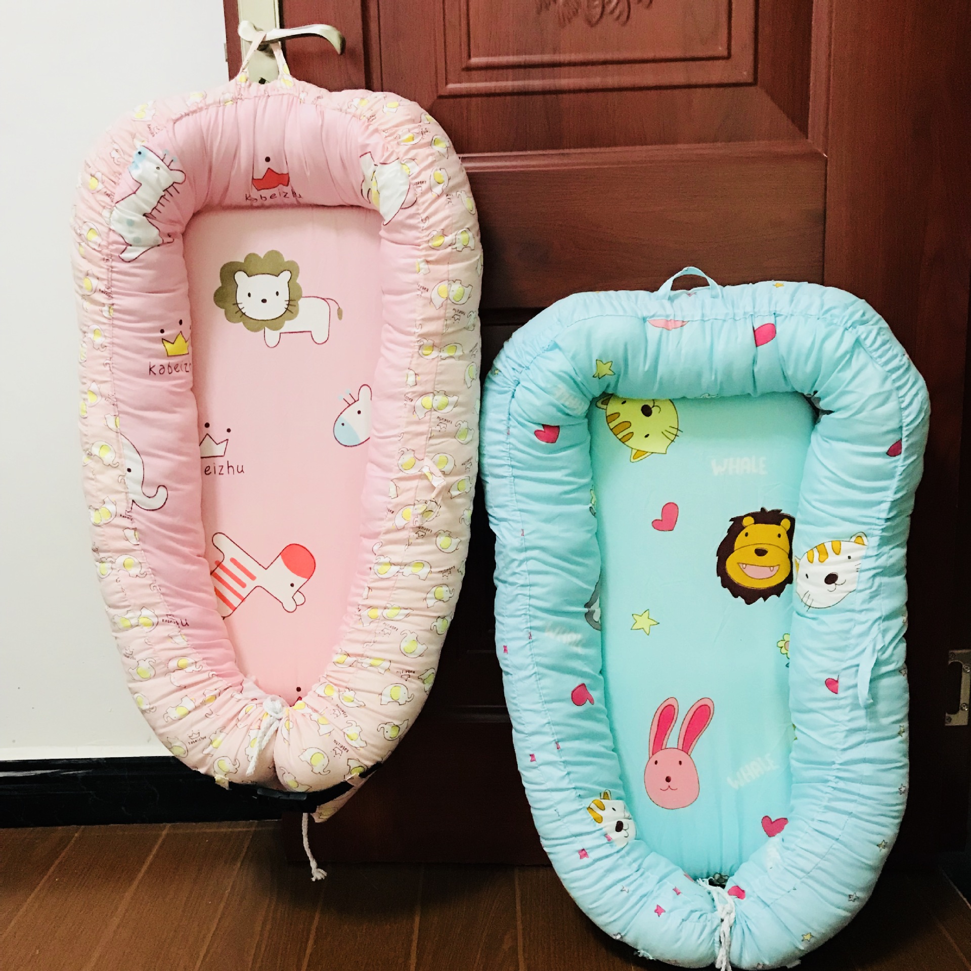 新款涤棉美国婴儿子宫仿生床 便携式可拆洗新生儿床中床产品图