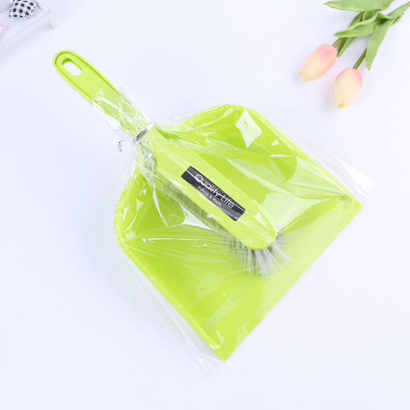 Household cleaning supplies Green shovel with broom pan and brush details Picture