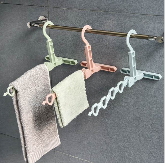 新款挂壁式可折叠衣架 多功能旅行便携带塑料衣架 5孔晾晒架批发细节图