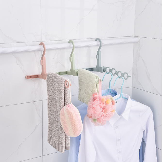 新款挂壁式可折叠衣架 多功能旅行便携带塑料衣架 5孔晾晒架批发产品图