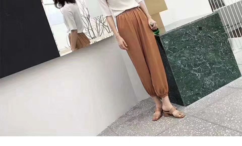 Set of warm pants in rose color laid out neatly