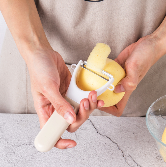 Multi-functional stainless steel plastic fruit peeler, apple peeler, melon and fruit slicer, peeling and planing knife details Picture