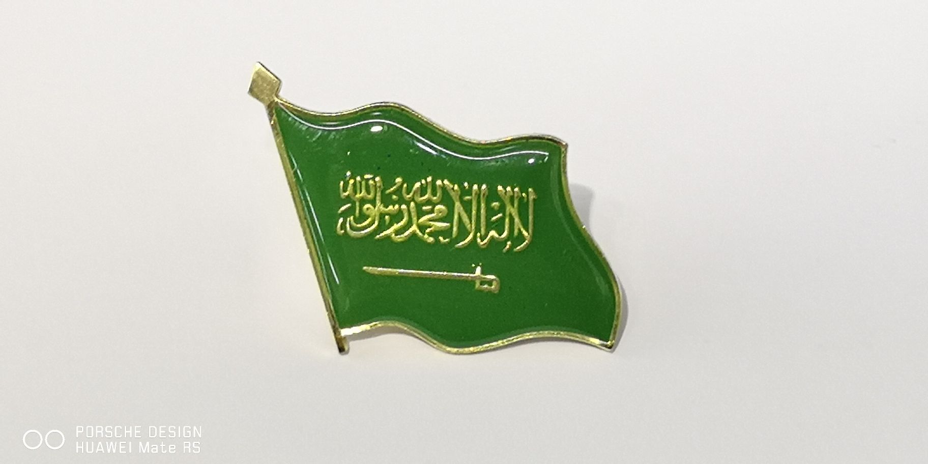 The Saudi flag, emblem and chest badge