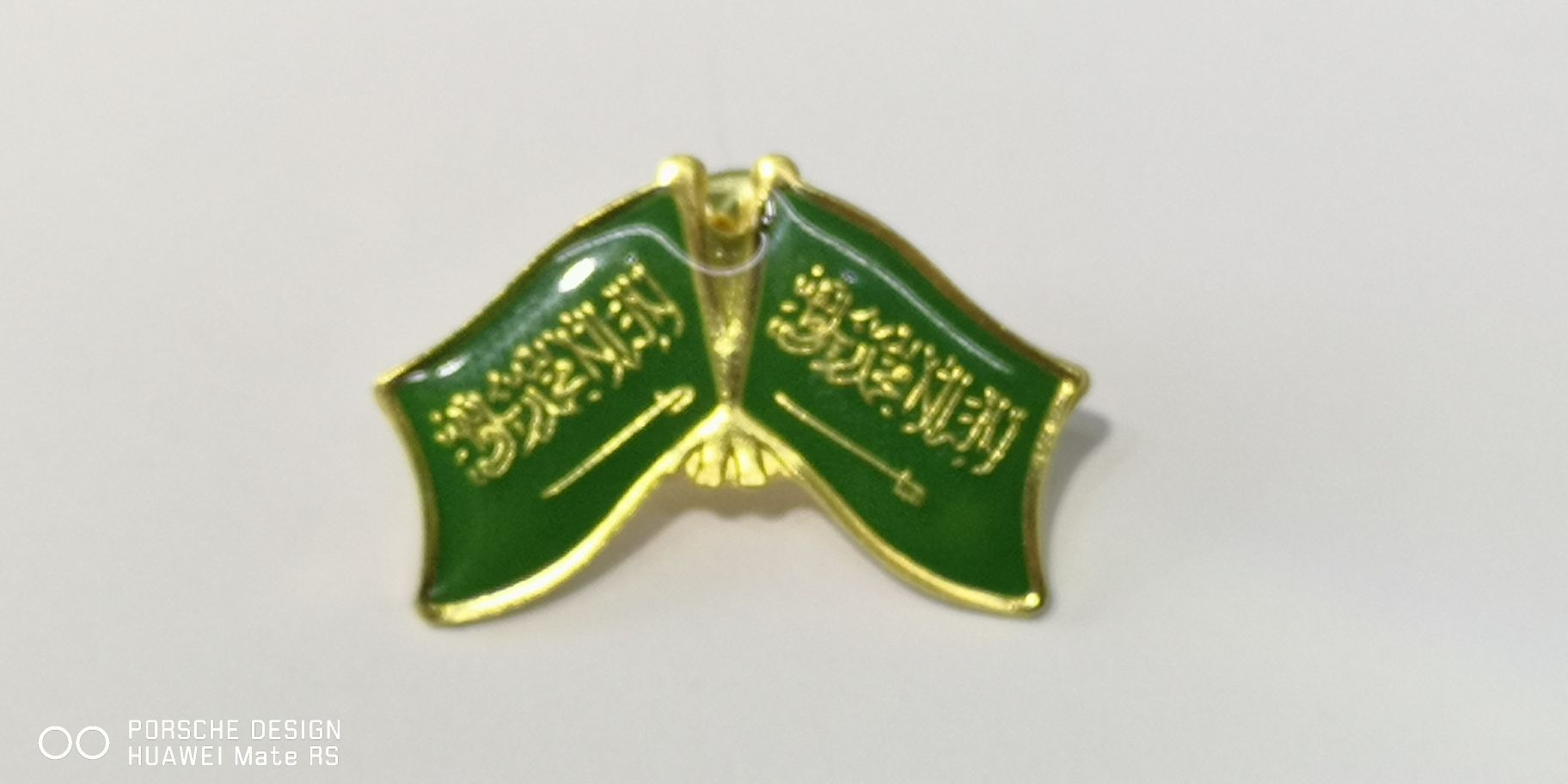 The Saudi flag, emblem and chest badge details Picture