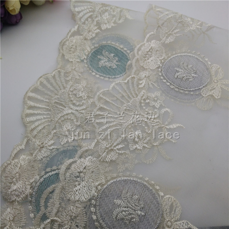 Embroidered lace on mesh fabric