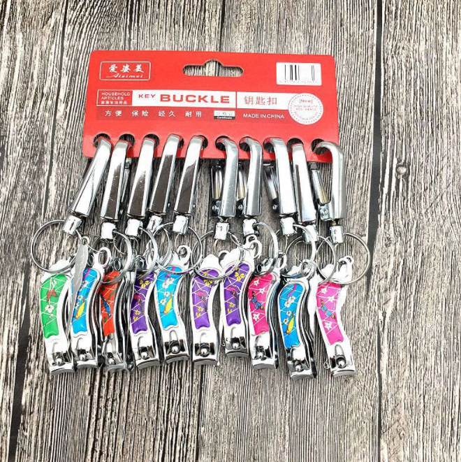 An affordable 3-piece set of electroplated iron keychains with foot pads, nail clippers and ear picks for 2 yuan from street vendors details Picture