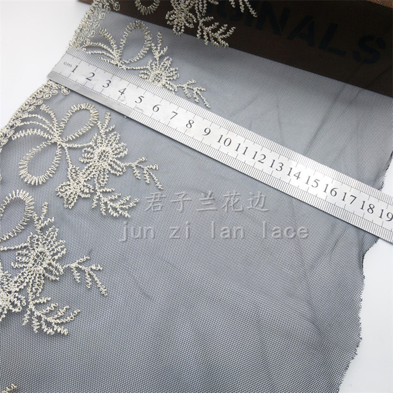 Embroidered lace on mesh fabric details Picture
