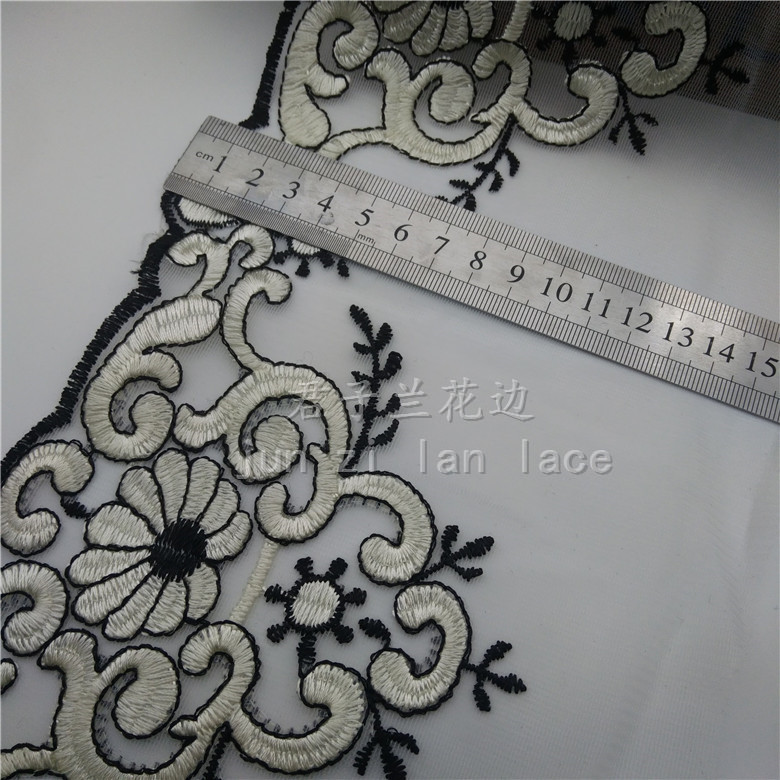 Embroidered lace on mesh fabric details Picture