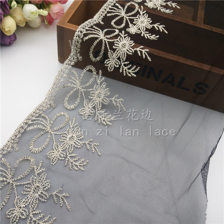 Embroidered lace on mesh fabric