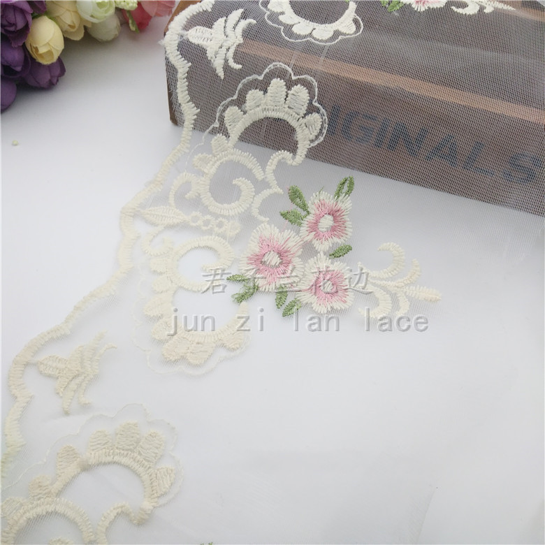 Embroidered lace on mesh fabric