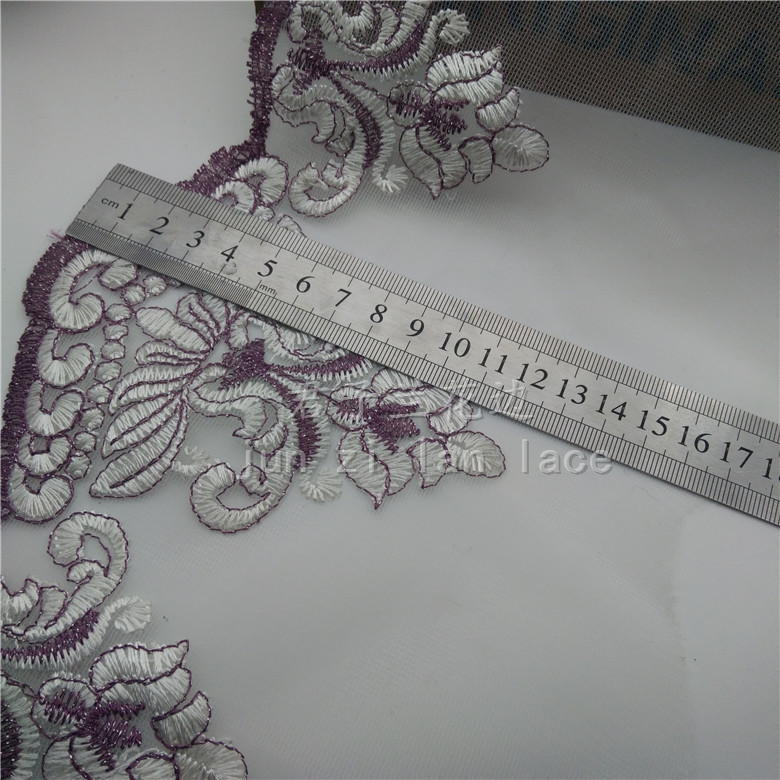 Embroidered lace on mesh fabric details Picture