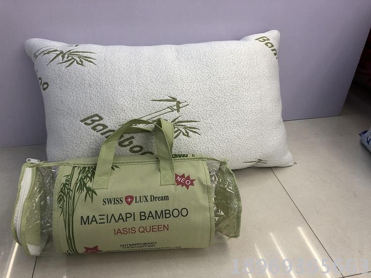 A space-saving, crumpled memory foam, rolled and compressed green bamboo fiber 7145 size bread-shaped memory pillow