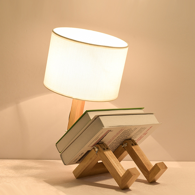 Solid wood humanoid lamp creative personality Nordic fashion study bedroom bedside wooden robot folding LED lamp