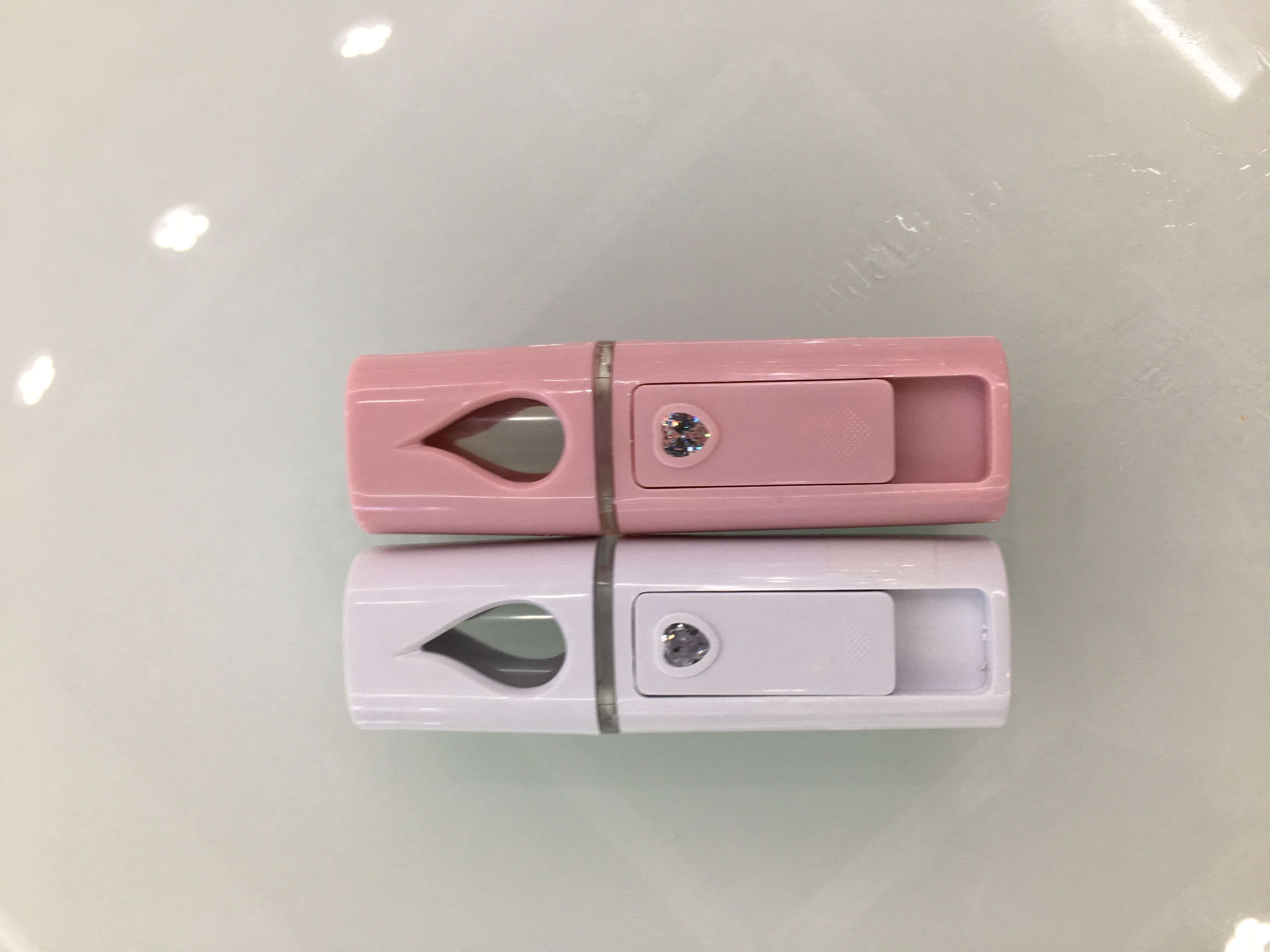 喷精油补水仪 纳米喷雾器大喷雾蒸脸保湿充电宝手持补水美容仪器白底实物图