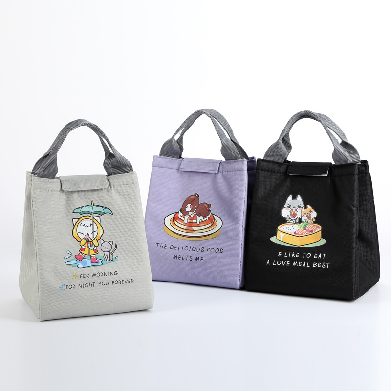 现货自主研发开版饭盒包厂家批发牛津布饭盒包可爱卡通学生饭盒袋白底实物图