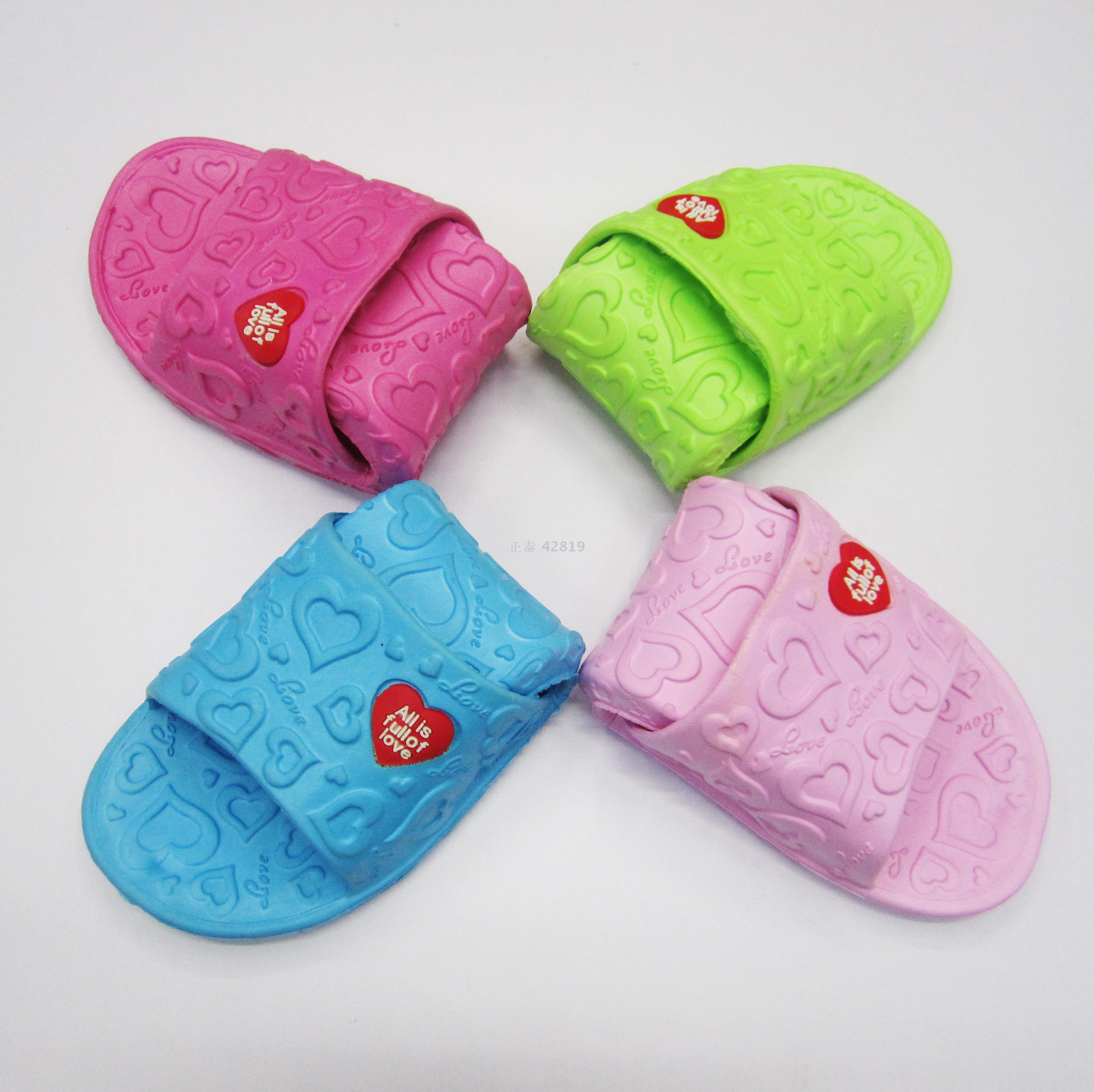 A pair of EVA slippers for women's home bathroom are available in stock