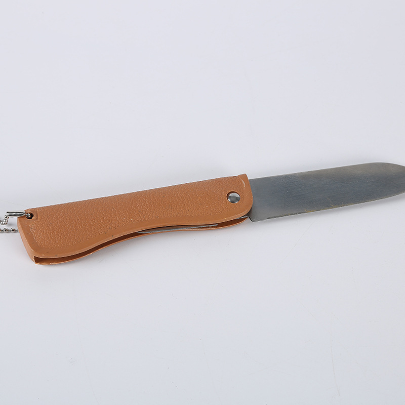 A portable mini fruit knife with a wood-like plastic handle folding knife and bottle opener, available for wholesale at a 1-yuan store street stall details Picture