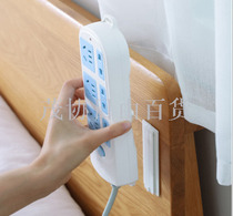 The back adhesive is affixed to the separation strip, socket holder, wall mount, socket support, and garbage can