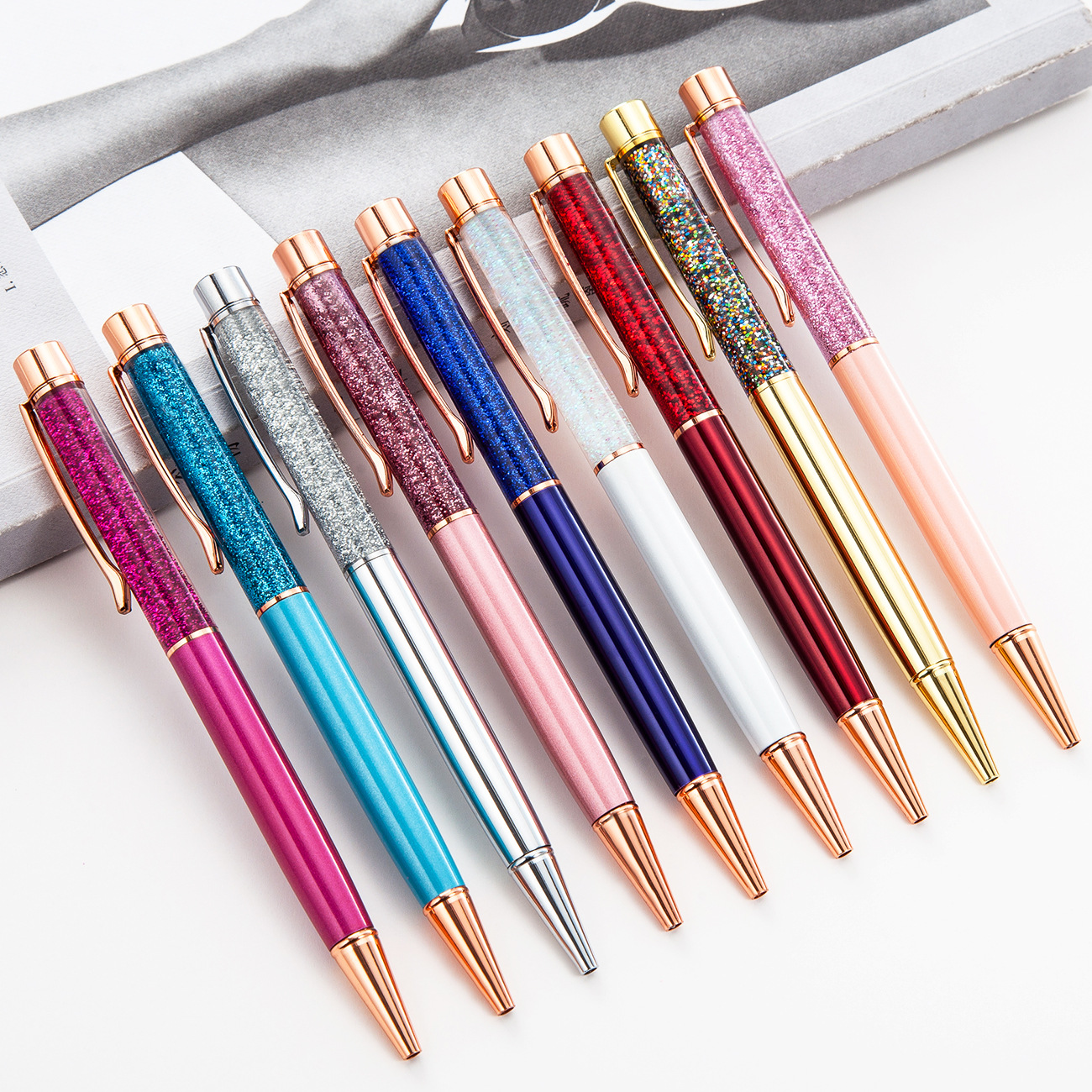 Wholesale of creative gold powder and gold foil oil pens, advertising promotion gift pens, business office multi-color metal hourglass pens
