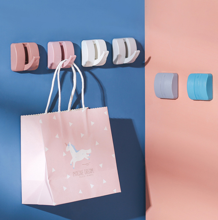 Creative candy-colored hidden hook, strong and seamless adhesive hook, household wall hook without drilling, load-bearing and nail-free Application Scenario