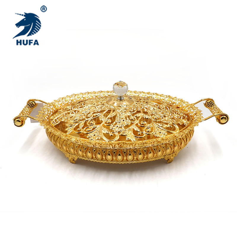 A large-sized metal oval-shaped gold chocolate fruit plate with handles and a lid details Picture