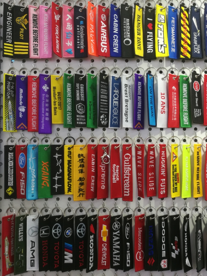 Twill fabric lockstitch double-sided embroidered aviation pendants, luggage pendants, motorcycle and motorcycle embroidered keychains Application Scenario