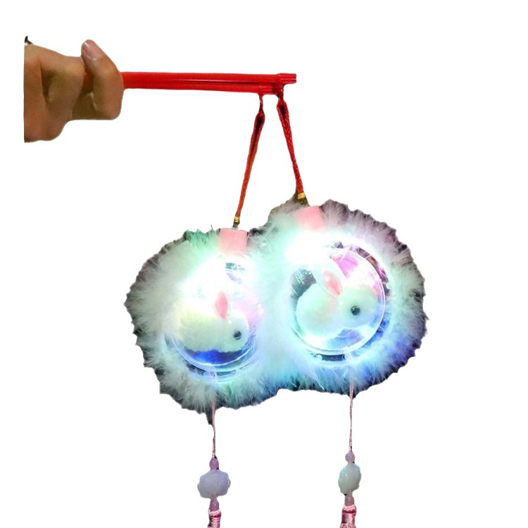 New illuminated jade rabbit lanterns for the Mid-Autumn Festival, children's hand-held rabbit lanterns, and the Spring Festival illuminated toys are selling well at stalls Item Picture