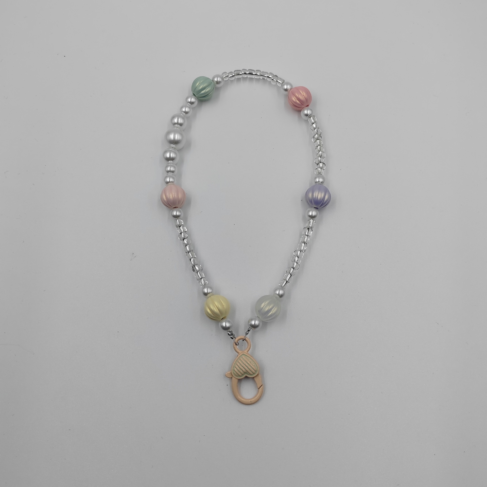 New mobile phone pendant, short wrist hand-painted heart-shaped buckle chain, creative beaded pendant, women's style rice beads, colorful beads