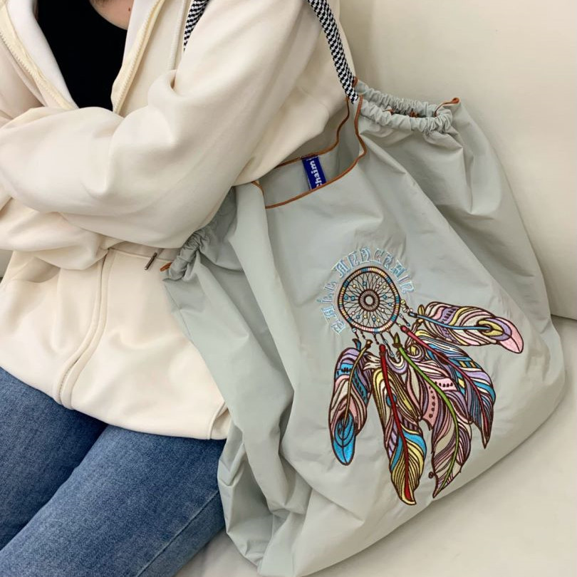New feather embroidery eco-friendly bag, large-capacity nylon crossbody, foldable portable hand-held shopping bag, single-shoulder bag Application Scenario
