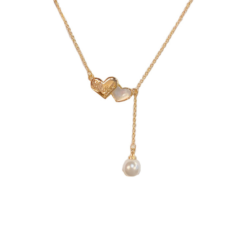 This is a unique, fashionable, sweet and versatile double heart-shaped pearl tassel necklace with a touch of elegance, individuality, and a light luxury design. It's a collarbone chain for women Item Picture