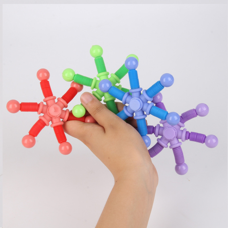 抖音同款厂家直销跨境减压塑料玩具可变形指尖伸缩管陀螺批发白底实物图
