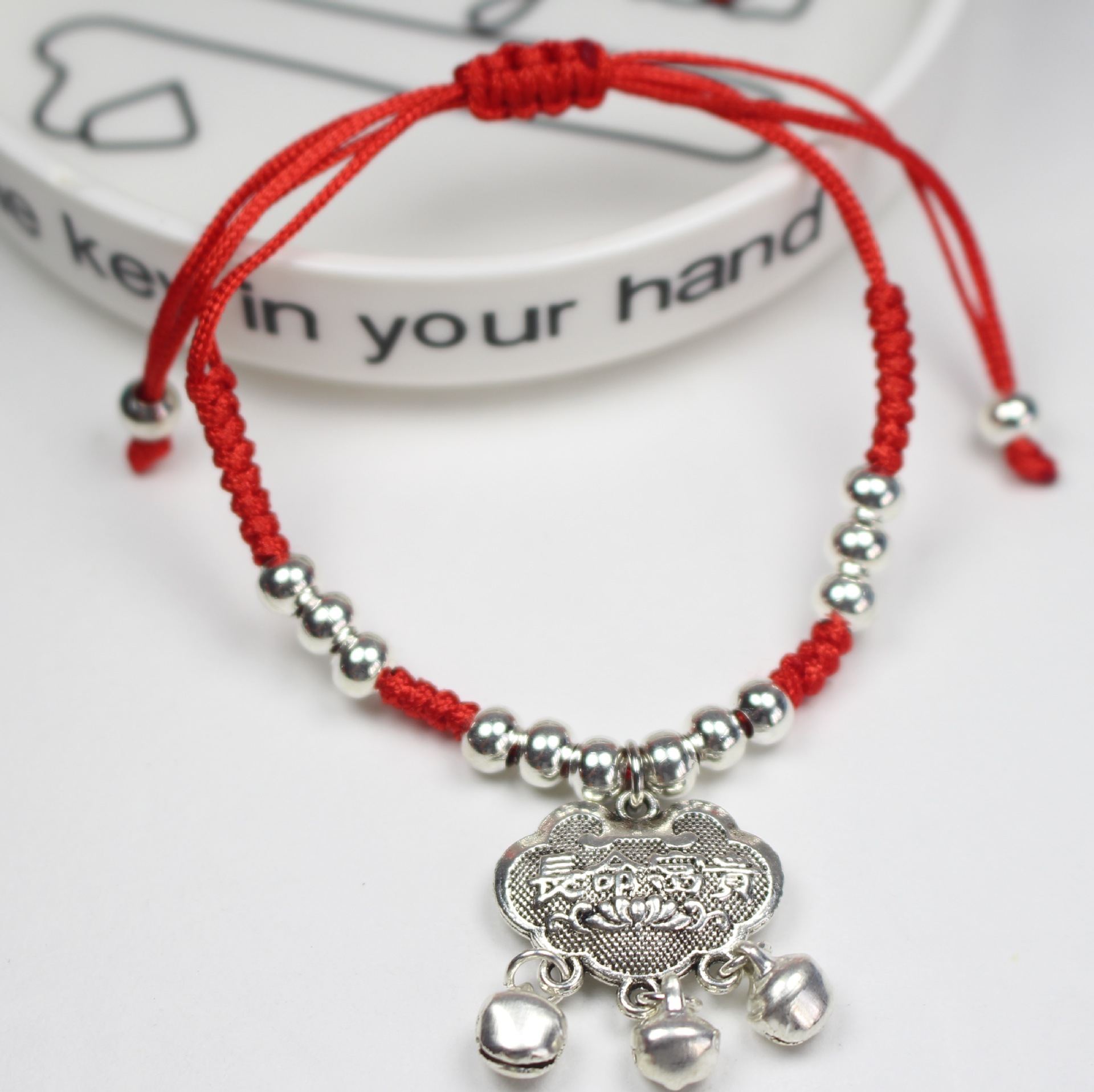 The zodiac year imitation Tibetan silver red rope bracelet and ankle bracelet, traditional Chinese hand-woven Miao silver bracelet, best friend and couple bell jewelry Application Scenario