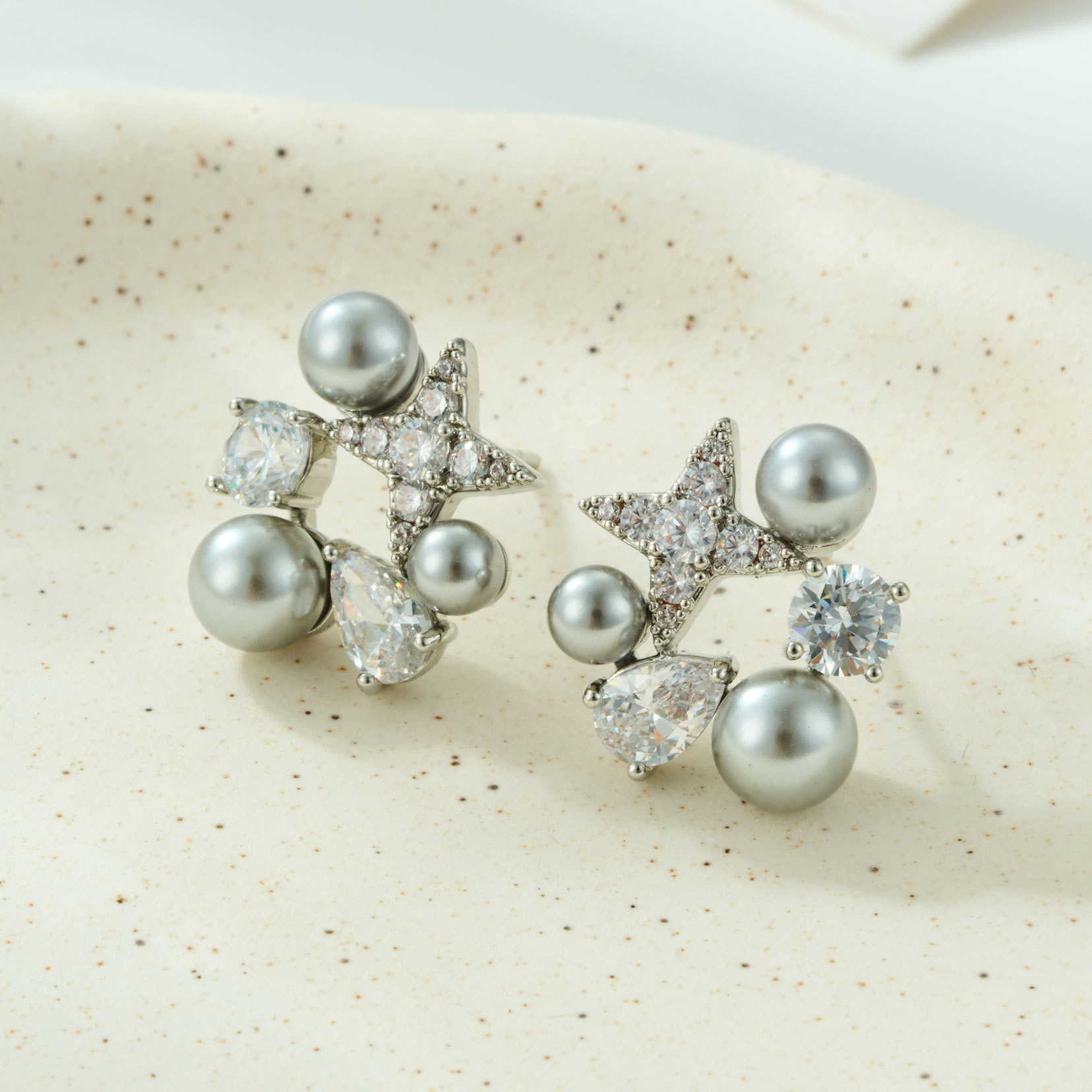 Exquisite and dynamic star-shaped pearl stud earrings made of copper alloy with slightly inlaid zircon s925 silver needles Application Scenario