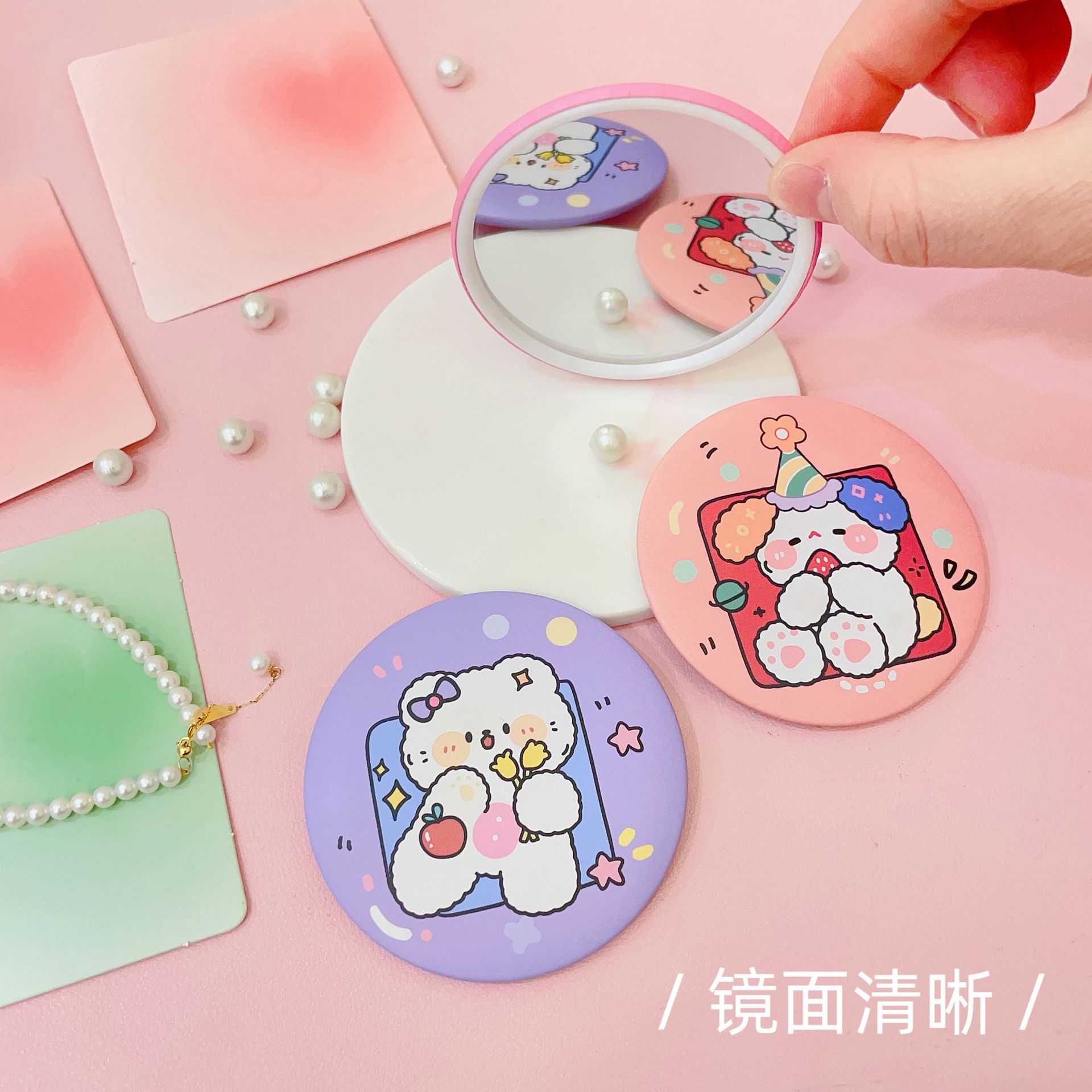 Six cute round hand-held folding makeup mirrors with pearl-colored paper backgrounds featuring colorful cartoon animal bread details Picture