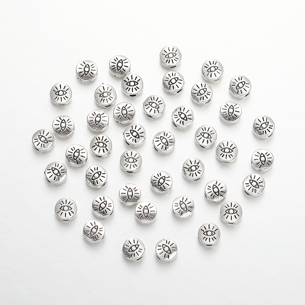 Cross-border classic and personalized alloy eye flat spacer beads, retro imitation silver wholesale pendants, bracelets, necklaces, clothing accessories Specification image