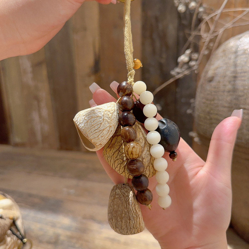 Natural fruit shell wind chime pendant, forest-style plant healing bell, full wish seed string, stress-relieving sound therapy bag, car pendant Application Scenario