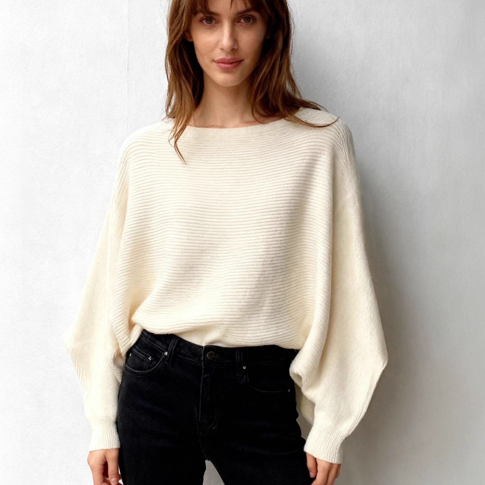 A loose knitted sweater with a one-shoulder collar and bat sleeves in stock. It's a great recommendation for women. You can come and buy it details Picture