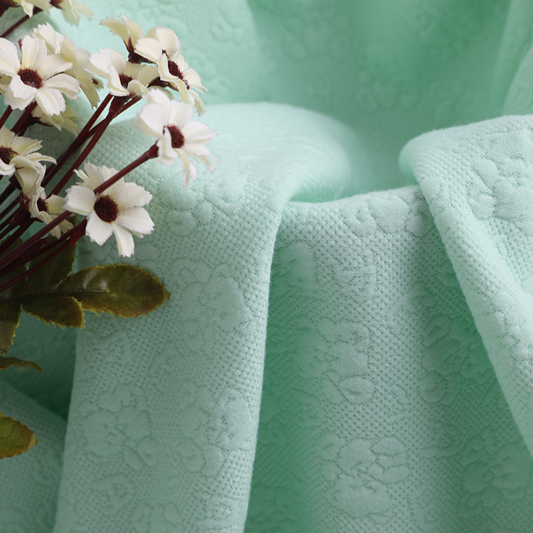 32s精梳针织提花面料针织提花空气层春夏童装全涤染色布面料