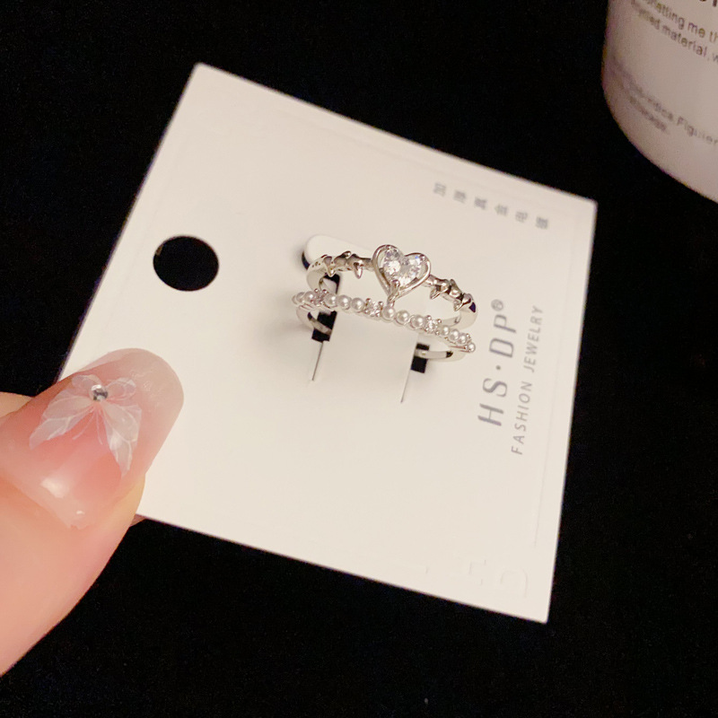 A light luxury and fashionable InS-style open-top ring for women, with a unique and simple design. It is a double-layered index finger ring made of zircon heart and pearl details Picture