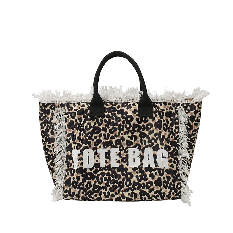 Cross-border canvas bag, denim print canvas bag, zebra print fringed letter canvas bag, large capacity bag, women's bag, new solid color commuting single-shoulder tote bag, beach bag, fringed canvas bag, tote bag, single-shoulder bag, canvas bag Item Picture