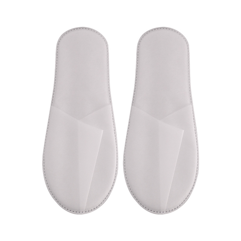 Wholesale of disposable slippers for hotels, household hospitality and travel supplies, non-woven fabric thickened slippers for hotels and homestays Item Picture