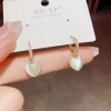 Douyin's popular fashion, clear and transparent cat's eye stone heart-shaped ear buckle women's summer new style, high-end, versatile and sweet earrings details Picture